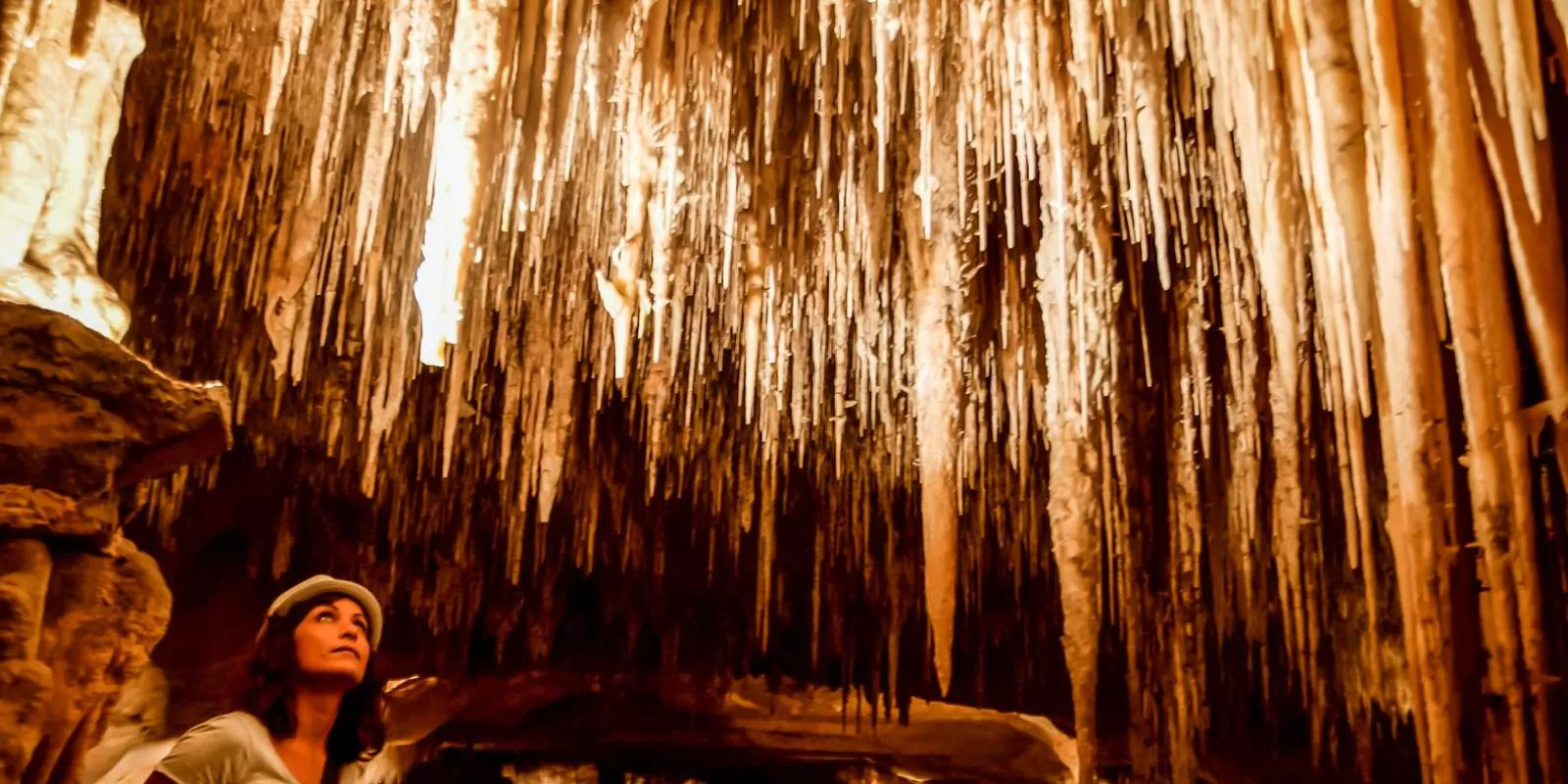 Caves of Drach visitor looking up at a ceiling covered in thousands of needle-thin stalactites — Mallorca